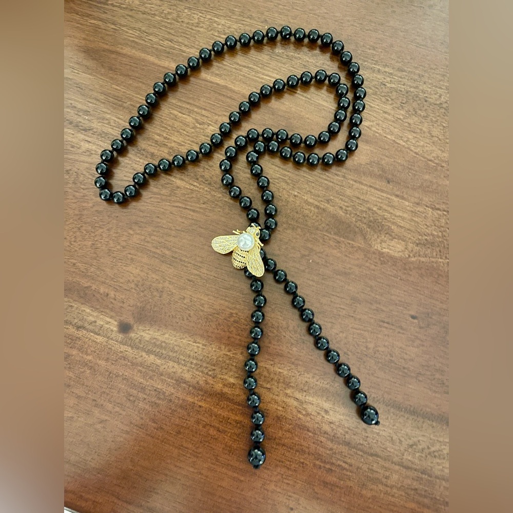 Elegant Black Beaded Necklace with Gold and Crystal Bee Pendant